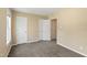 Bedroom with neutral walls and carpeting featuring lots of sunlight through a window at 4802 Parkville Dr, Raleigh, NC 27604