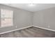 A neutral bedroom features plush carpet, fresh paint and a window for natural light at 517 Eagles Way, Mebane, NC 27302