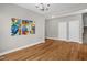 Dining area with hardwood floors, neutral paint, chandelier, and open access to the stairway at 517 Eagles Way, Mebane, NC 27302