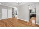 Open-concept with hardwood floors, neutral paint, and views into the living room and kitchen at 517 Eagles Way, Mebane, NC 27302