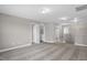 Open loft space with carpet flooring, leading to a laundry area and other rooms at 517 Eagles Way, Mebane, NC 27302