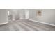Bright upstairs loft area featuring carpet flooring, stairway, deer artwork, and a pendant light fixture at 517 Eagles Way, Mebane, NC 27302