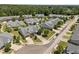 An aerial view of a neighborhood surrounded by mature trees at 5216 Marcella Ct, Durham, NC 27707
