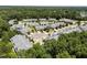 An aerial view of a neighborhood with manicured lawns and mature trees in a residential neighborhood at 5216 Marcella Ct, Durham, NC 27707