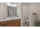 Bathroom featuring a wood vanity, neutral walls and flooring, plus a toilet at 5216 Marcella Ct, Durham, NC 27707