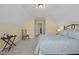 Cozy bedroom featuring angled ceilings, soft carpet, and a comfortable bed with blue linens at 5216 Marcella Ct, Durham, NC 27707