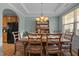 Charming dining area featuring wood furniture, a decorative hutch, and tray ceiling at 5216 Marcella Ct, Durham, NC 27707