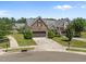 Charming stone home with a two-car garage, manicured lawn, and inviting curb appeal in a planned community at 5216 Marcella Ct, Durham, NC 27707