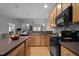 Bright kitchen with stainless steel appliances, spacious island, and open layout to the living area at 5216 Marcella Ct, Durham, NC 27707