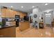 Modern kitchen with wood cabinets, an island, and contemporary appliances at 5216 Marcella Ct, Durham, NC 27707