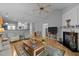 Spacious living room with hardwood floors, a fireplace, and ample seating at 5216 Marcella Ct, Durham, NC 27707