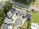 An aerial view of the home, located within a residential area near a highway at 533 Kings Lake Way, Durham, NC 27703