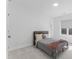 Bright bedroom with neutral tones offers a comfortable space with natural light and cozy furnishings at 533 Kings Lake Way, Durham, NC 27703