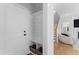 Foyer with mudroom area, featuring built-in storage, leading to the open-concept living area at 533 Kings Lake Way, Durham, NC 27703