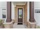 Stylish front door with stone accents and modern hardware at 533 Kings Lake Way, Durham, NC 27703