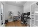 Cozy office featuring hardwood floors, shelving units, desk and chair, with natural light at 533 Kings Lake Way, Durham, NC 27703