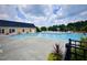Enjoy this large community pool area with plenty of seating and shady umbrellas on a sunny day at 533 Kings Lake Way, Durham, NC 27703