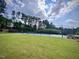 Get some exercise on this community tennis court with mature trees overlooking the court at 533 Kings Lake Way, Durham, NC 27703