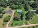 Aerial view of a rural neighborhood showing homes nestled among mature trees and private lawns at 64 Doughty Ln # E, Middlesex, NC 27557