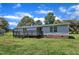 Exterior view of the home's backyard, showcasing a large lawn at 64 Doughty Ln # E, Middlesex, NC 27557