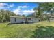 Exterior view of a one-story home with a front porch and grassy yard at 64 Doughty Ln # E, Middlesex, NC 27557