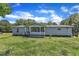 Exterior view of a one-story home with a front porch and grassy yard at 64 Doughty Ln # E, Middlesex, NC 27557