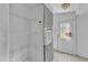 A bright pantry features wire shelving, a side-by-side refrigerator and freezer, and an exterior door at 64 Doughty Ln # E, Middlesex, NC 27557