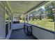 Covered porch with a nice view of the green grassy yard at 64 Doughty Ln # E, Middlesex, NC 27557