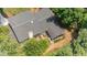 Aerial view of the home showing the roof, patio, and lush surrounding trees at 6609 Electra Dr, Raleigh, NC 27607