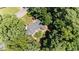Overhead aerial shot reveals house roof and treed lot in a serene, leafy setting at 6609 Electra Dr, Raleigh, NC 27607