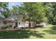 Expansive backyard with a covered patio and lush landscaping, perfect for outdoor entertaining at 6609 Electra Dr, Raleigh, NC 27607