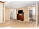 Bedroom features a dresser, television, closet, and access to an on-suite bathroom at 6609 Electra Dr, Raleigh, NC 27607