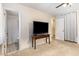 Bedroom featuring a TV and an attached bathroom with a tiled shower at 6609 Electra Dr, Raleigh, NC 27607