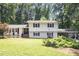 Charming two-story home with a well-manicured lawn and mature trees, showcasing classic curb appeal at 6609 Electra Dr, Raleigh, NC 27607