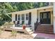 Inviting front porch with seating, creating a cozy and welcoming entrance to the home at 6609 Electra Dr, Raleigh, NC 27607