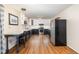 Eat-in kitchen features two-tone cabinets, stainless appliances, and hardwood floors at 6609 Electra Dr, Raleigh, NC 27607
