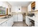 Laundry area with white cabinets, sink and granite countertops, including a washer and dryer at 6609 Electra Dr, Raleigh, NC 27607