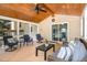 Outdoor porch features ceiling fan, and wood flooring. Exterior views to lawn at 6609 Electra Dr, Raleigh, NC 27607