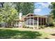 Spacious screened-in porch offers outdoor living and dining space with backyard views at 6609 Electra Dr, Raleigh, NC 27607