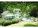 Backyard featuring a fenced pool, a deck, a patio, and mature trees at 7216 Rabbit Run, Wake Forest, NC 27587