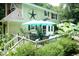 Outdoor deck featuring patio table set, grill, and green plants at 7216 Rabbit Run, Wake Forest, NC 27587