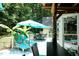 Inviting outdoor seating on deck featuring patio table set, lounge chairs, and backyard view at 7216 Rabbit Run, Wake Forest, NC 27587