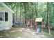 Private backyard features a playset, green space, and mature trees at 7216 Rabbit Run, Wake Forest, NC 27587