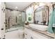 Bathroom featuring brick accent wall, bathtub with shower, and bowl sink at 7216 Rabbit Run, Wake Forest, NC 27587