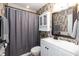 Stylish bathroom featuring floral wallpaper, vanity with storage, and shower with gray curtain at 7216 Rabbit Run, Wake Forest, NC 27587