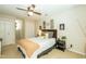 Bright bedroom with ceiling fan, carpet, and view of outside at 7216 Rabbit Run, Wake Forest, NC 27587