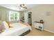 Bright bedroom featuring ceiling fan, carpet, dresser, and an ensuite bathroom at 7216 Rabbit Run, Wake Forest, NC 27587