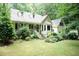 Attractive home with an inviting entrance, surrounded by lush greenery at 7216 Rabbit Run, Wake Forest, NC 27587