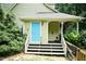 Exterior view of a light-blue door with stairs and railings to the house at 7216 Rabbit Run, Wake Forest, NC 27587