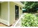 Charming home with an inviting front door, steps, and lush landscaping at 7216 Rabbit Run, Wake Forest, NC 27587